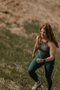A happy Ellyn walks up a hill